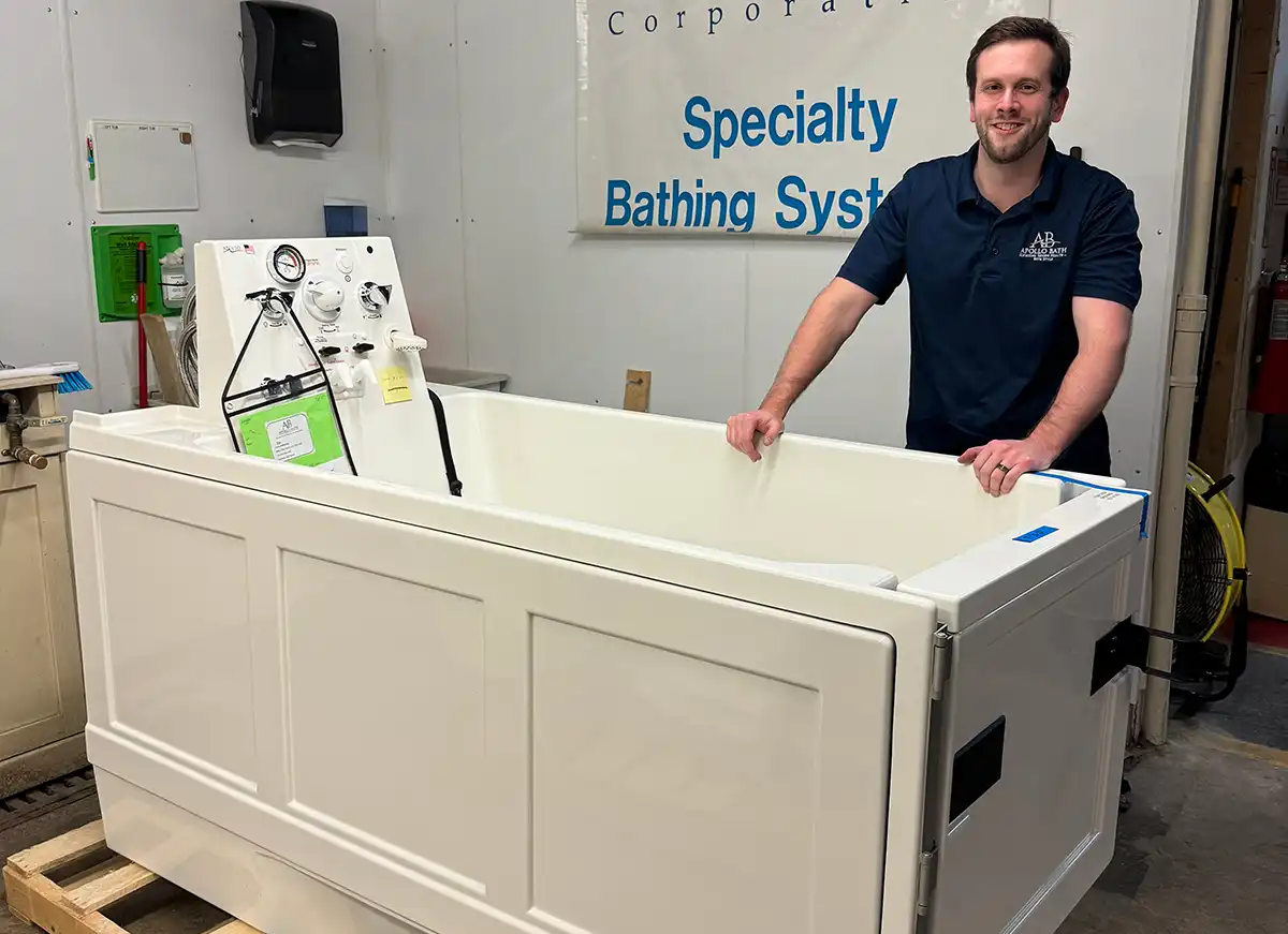 Our Team 4 Apollo Bath team member showcasing Apollo walk-in tub designed for seniors and disabled users